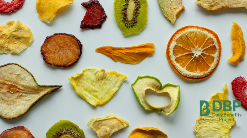 Variety of dried fruits such as kiwi, orange, pear and berries on a white background