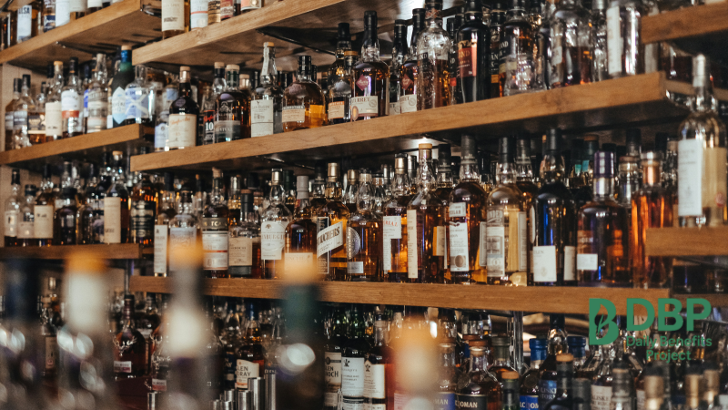 Shelves of alcohol bottles symbolizing the effect of alcohol on high blood pressure