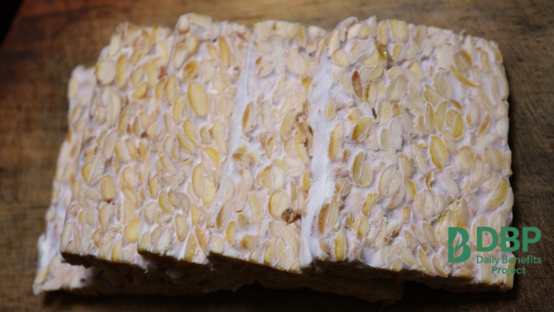Tempeh – fermented soy vegan food sliced tempeh on a cutting board