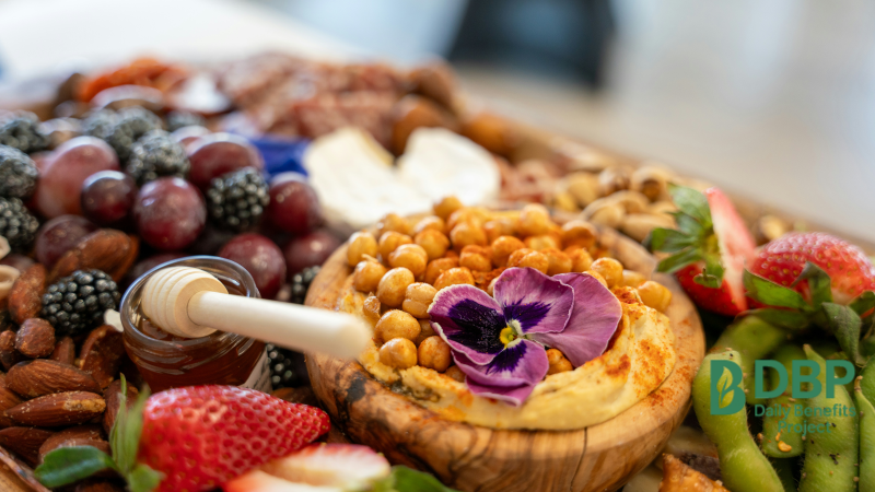 Assorted snack platter with fresh fruits, nuts and roasted chickpeas