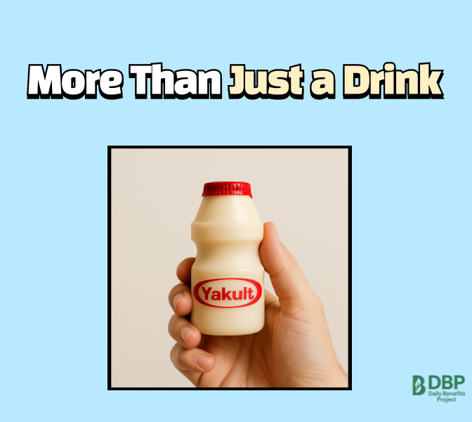 Hand holding a Yakult bottle with "More Than Just a Drink"