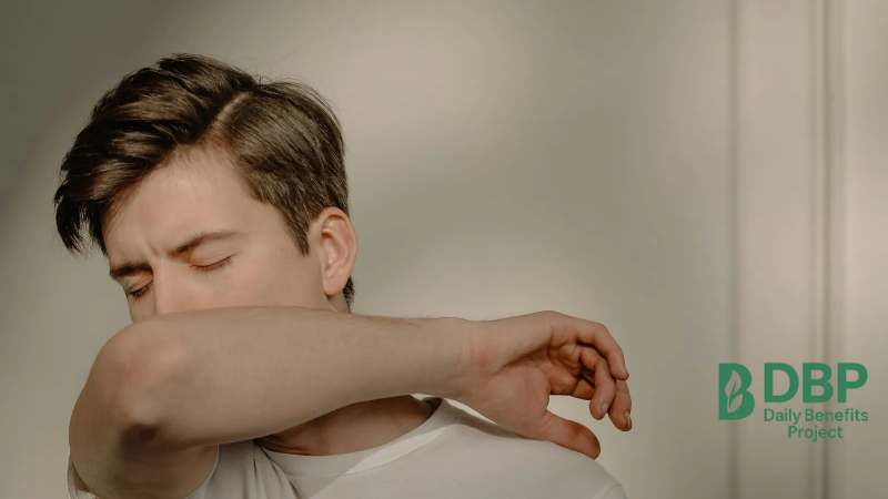Man sneezing showing weak immunity A man sneezing into his elbow, symbolizing low immunity