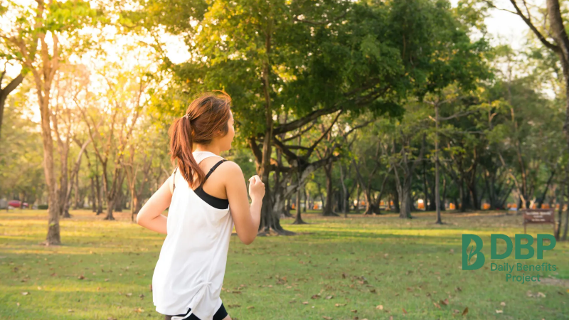 Running outdoors for a healthy immune system Woman jogging in a park to support overall immune health